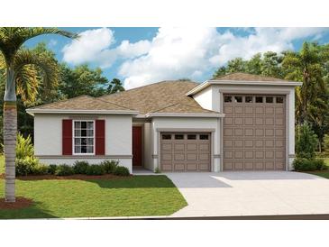 Two-car garage and a welcoming front porch at 2108 Riley Ave, Eagle Lake, FL 33839