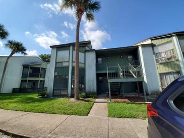 Condo building with ample parking and landscaping at 2616 Lemon Tree Ln # F, Orlando, FL 32839