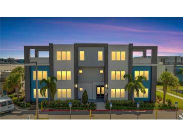 Modern building exterior with balconies and parking at 7770 Sandy Ridge Dr # 201, Reunion, FL 34747