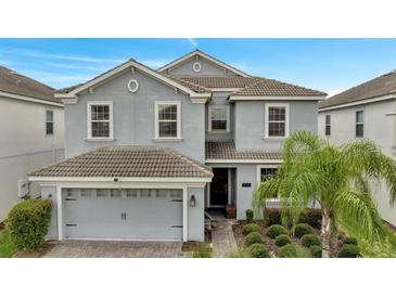 Two story house with a two car garage at 1536 Maidstone Ct, Davenport, FL 33896