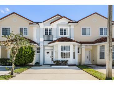 Two story townhome with front yard and driveway at 1256 S Beach Cir, Kissimmee, FL 34746