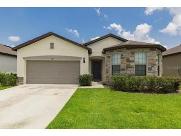 Two-story house with stone accents at 794 Citrus Isle Dr, Davenport, FL 33837