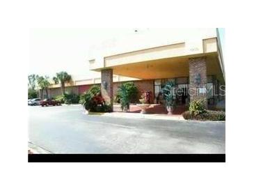 Exterior view of building with covered entrance at 7900 S Orange Blossom Trl # 1120, Orlando, FL 32809
