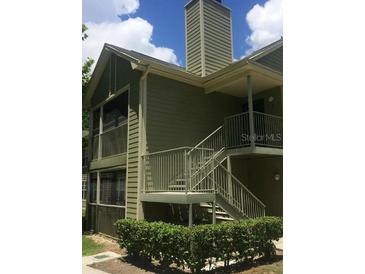 Two-story building with a staircase and screened porch at 3727 Lake Orlando Pkwy # 4, Orlando, FL 32808