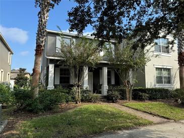Two-story house with front porch and landscaping at 13155 Kegan St, Windermere, FL 34786