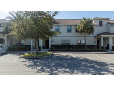Front view of a townhome with parking at 4845 Romeo Cir, Kissimmee, FL 34746