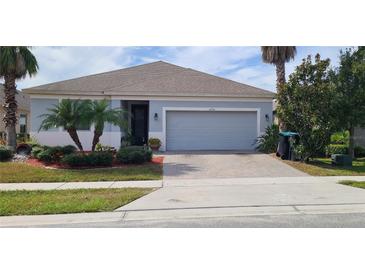 Single-story home with attached garage and landscaping at 12254 Sandy Apple Rd, Orlando, FL 32824