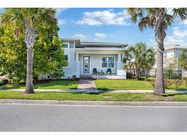 A charming single story home with a welcoming front porch and landscaping at 13010 Stoddart Ave, Orlando, FL 32827