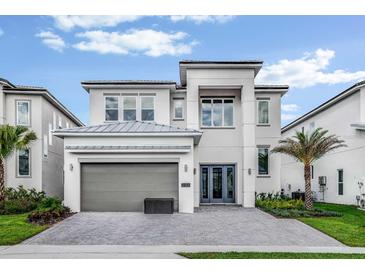 Modern two-story house with gray exterior at 2133 Pine Oak Loop, Davenport, FL 33837