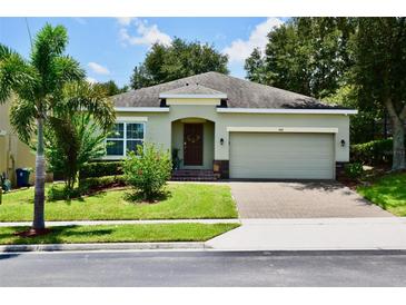 One-story house with a two-car garage and well-maintained lawn at 468 Andalusia Loop, Davenport, FL 33837