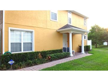 Inviting exterior with a charming walkway and well-manicured lawn at 4970 Poolside Dr, Saint Cloud, FL 34769