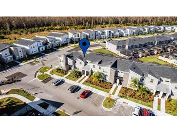 Aerial view of townhome community, highlighting a specific unit and its location at 4297 Paragraph Dr, Kissimmee, FL 34746