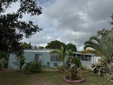 Ranch style home with mature landscaping and a spacious yard at 116 S 4Th St, Haines City, FL 33844