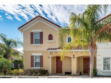 Two-story townhome with attractive facade and landscaping at 4735 Terrasonesta Dr, Davenport, FL 33837