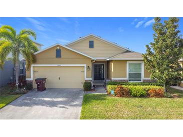 Attractive one-story house with a two-car garage and well-maintained landscaping at 1940 Banner Ln, St Cloud, FL 34769