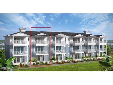 Three-story townhome building with light blue exterior and balconies at 3 Marden Dr, Ormond Beach, FL 32176