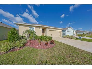 House exterior showcasing landscaping and driveway at 5394 Arlington River Dr, Lakeland, FL 33811