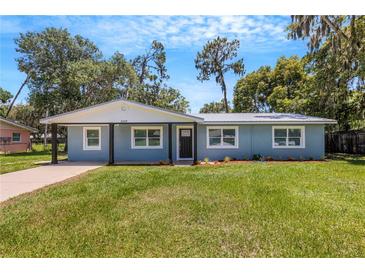 Newly renovated light blue home with a large yard at 3419 Lisa Ln, Lakeland, FL 33801