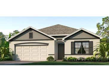 Two-story house with gray siding and a two-car garage at 140 Hickory Course Trl, Ocala, FL 34472