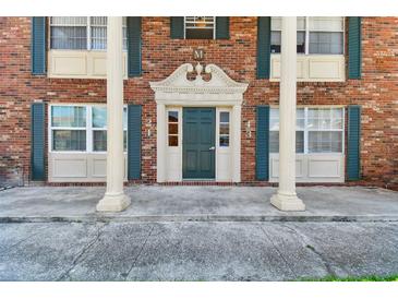 Brick building exterior with a classic entryway at 1920 E Edgewood Dr # M2, Lakeland, FL 33803