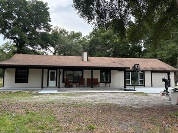 Ranch style home with covered porch and large backyard at 10566 Cr 671, Bushnell, FL 33513