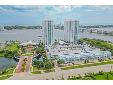 Aerial view of luxury condo complex with waterfront and bridge views at 231 Riverside Dr # 709, Daytona Beach, FL 32117