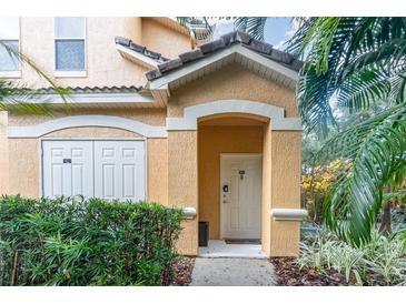 Inviting condo exterior with lush landscaping and a private entrance at 8830 Villa View Cir # 204, Orlando, FL 32821