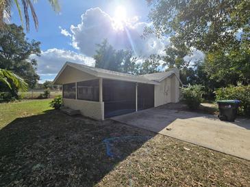Home's exterior features a screened porch at 3414 Portersfield Rd, Orlando, FL 32808
