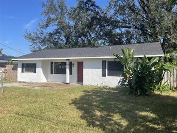 Newly renovated home with a red door and shutters at 1049 Edith Ave, Lakeland, FL 33805