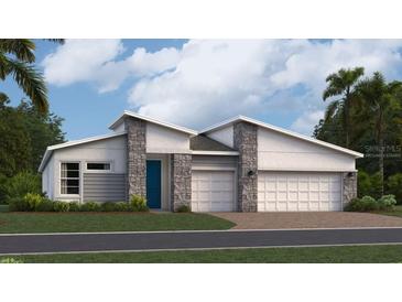 Modern two-story home with stone accents and two-car garage at 1705 Rider Rain Ln, Apopka, FL 32703