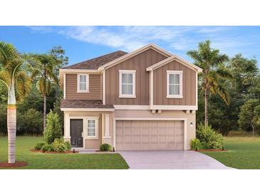 Two-story house with brown siding, a two-car garage, and landscaping at 4744 Guinep Ln, Kissimmee, FL 34758