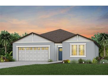 Single-story home with gray exterior, brown roof, and two-car garage at 486 Pine Tree Blvd, Lake Alfred, FL 33850