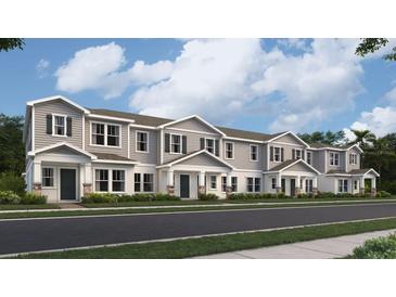 Attractive row of townhomes with covered entries and landscaped yards at 7005 Rosy Sky Ave, Orlando, FL 32829