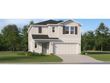 Two-story house with light beige siding, dark gray roof, and a two-car garage at 866 Hour Glass Rd, Lakeland, FL 33801