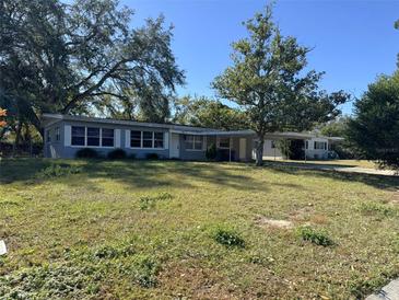 Gray Ranch home with mature landscaping at 2331 Olney Rd, Lakeland, FL 33801