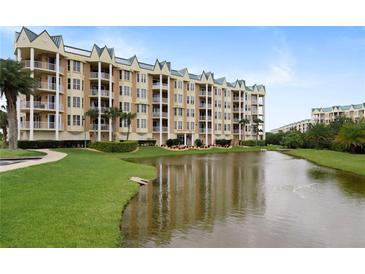 Building exterior overlooking a pond at 4672 Riverwalk Village Ct # 8201, Ponce Inlet, FL 32127