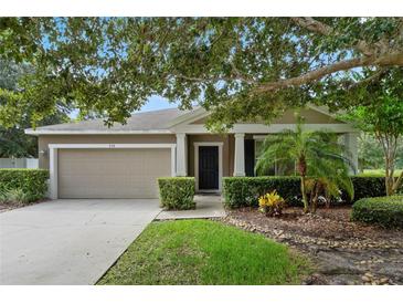One-story house with attached garage and landscaping at 968 Springs Landing Dr, Deltona, FL 32725