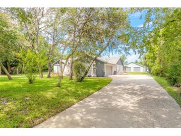 Photo one of 5803 Spruce Creek Woods Dr Port Orange FL 32127 | MLS V4937163