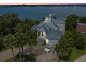Luxury waterfront home with private dock and expansive water views at 200 John Anderson Dr, Ormond Beach, FL 32176