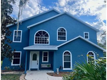 Two-story house with blue exterior and white accents at 399 Walrock St, Debary, FL 32713