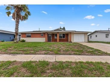 Single story home with brick facade and lawn at 22 Morning Star Ave, Ormond Beach, FL 32176
