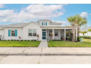 Charming two-story home with front porch and landscaping at 623 Margaritaville Ave, Daytona Beach, FL 32124