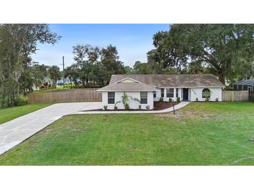 Newly renovated single-story home with a spacious lawn at 2730 Woodland Dr, Edgewater, FL 32141