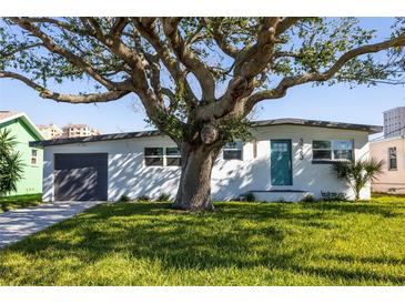 Newly renovated home with a modern facade and spacious lawn at 3263 S Peninsula Dr, Daytona Beach, FL 32118