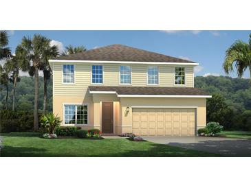 Two-story house with beige siding, brown door, and two-car garage at 480 Crossings Ave, Saint Cloud, FL 34771