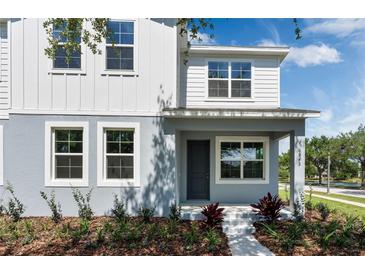 Two-story house with gray and white exterior at 6923 Five Oaks Dr, St Cloud, FL 34773
