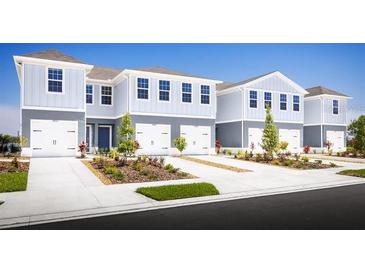 New townhouses with attached garages and landscaping at 2310 Incandescent Way, South Daytona, FL 32119