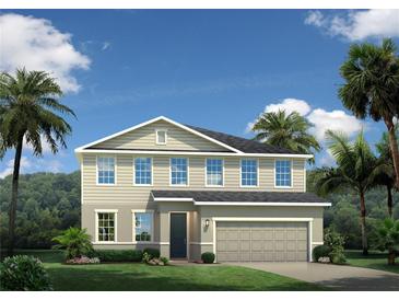 Two-story house with gray siding, gray roof, and a two-car garage at 5724 Freshwater Canyon Dr, St Cloud, FL 34771