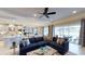 Spacious living room with a sectional sofa and access to a pool area at 1341 Arklow Cir, Ormond Beach, FL 32174