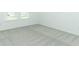 Spacious bedroom with grey carpet and neutral walls at 178 Jones Fish Camp Rd, Edgewater, FL 32141